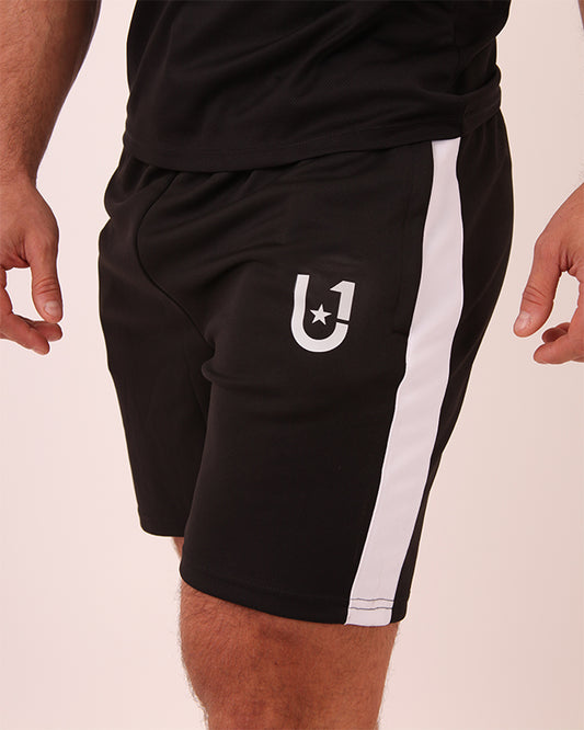 Front view of UNIFY men's black and white striped shorts