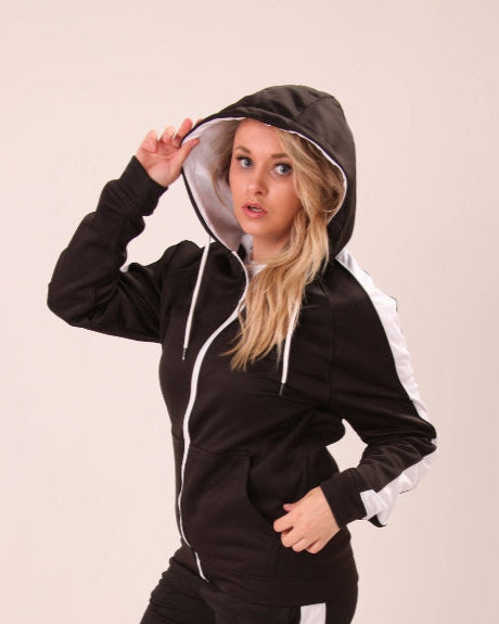 "Detail of UNIFY U1 women's black hoodie with white stripe, showcasing the zipper and tailored fit."
