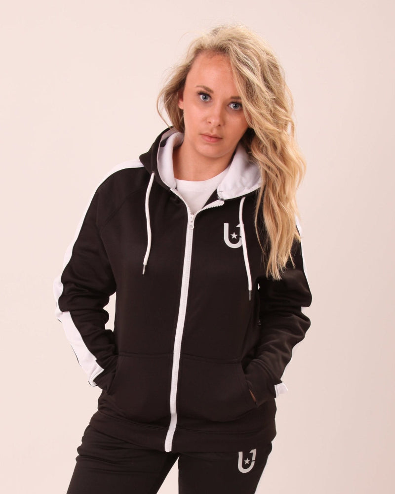 "UNIFY U1 women's black zip-up hoodie with a sophisticated white stripe, perfect for versatile styling."
