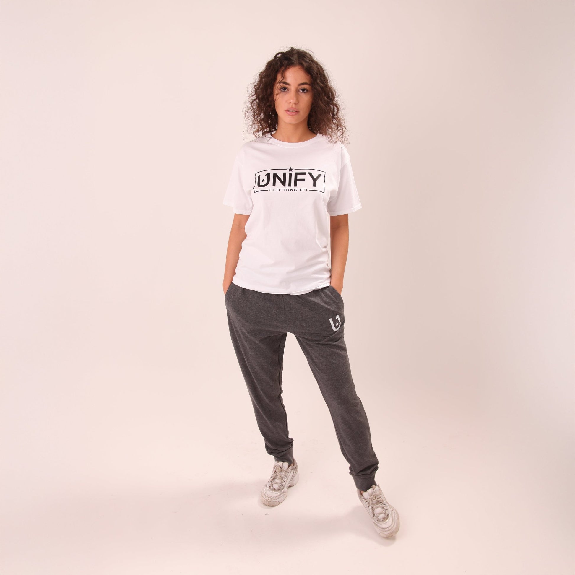 UNIFY women's essential grey joggers showcased, offering a perfect blend of elegance and comfort for daily wear.