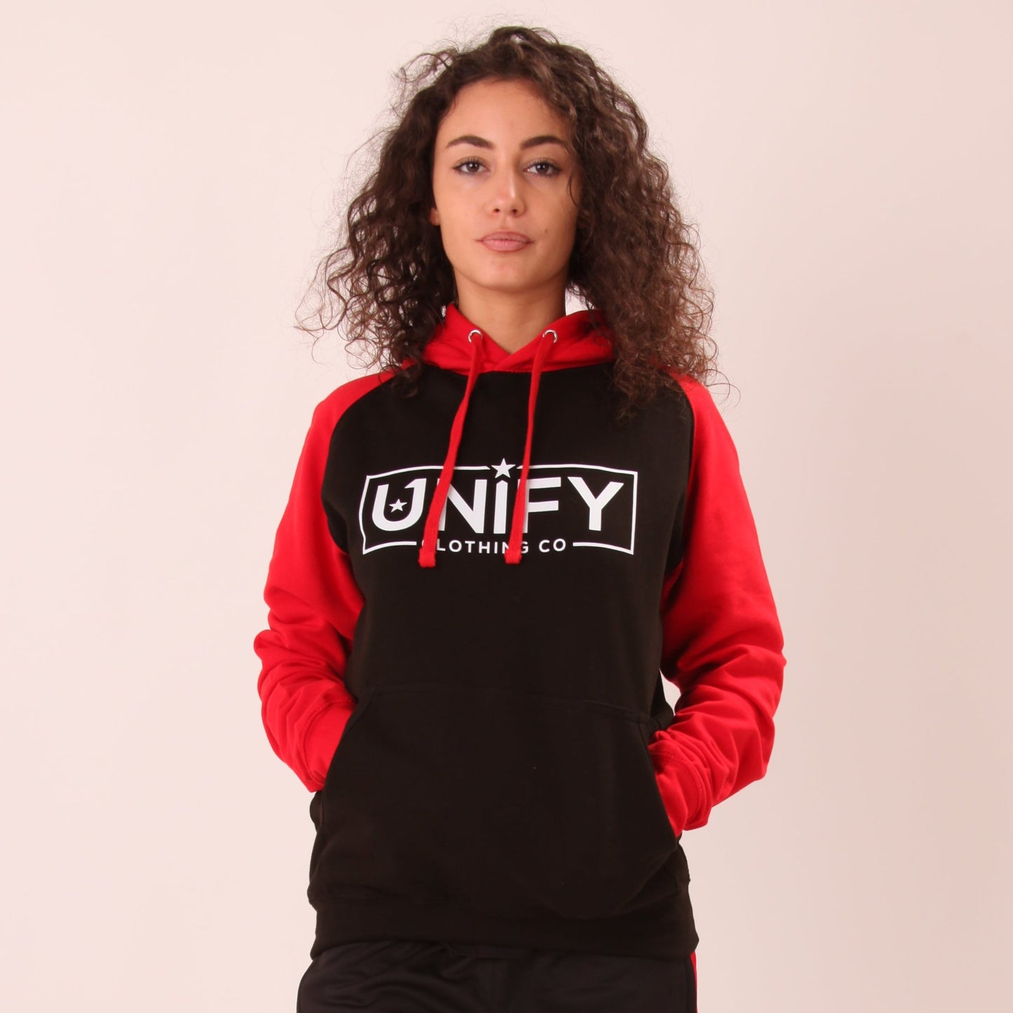 "UNIFY Women's Essential Hoodie in vibrant colours, perfect for casual wear and lounging."

