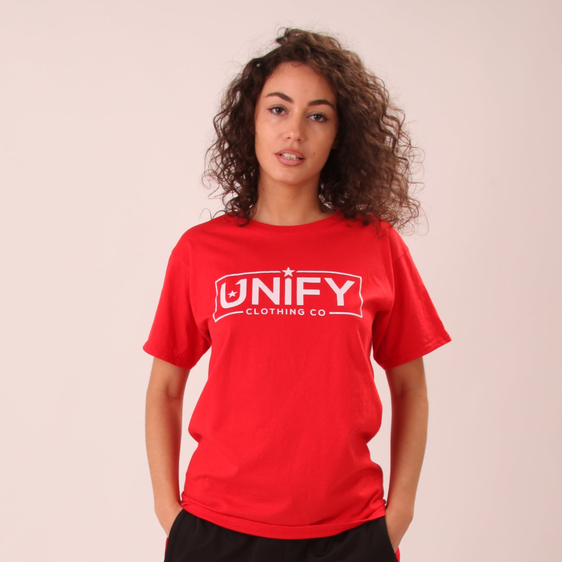 "UNIFY women's radiant red t-shirt, perfect for adding a bold touch to any casual outfit."
