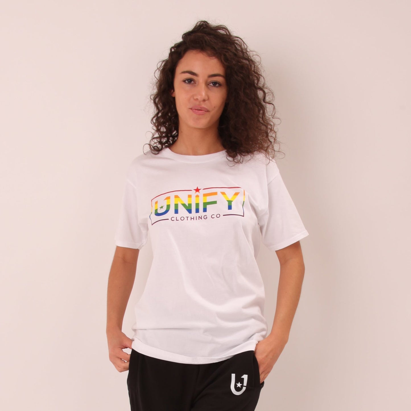 "UNIFY Women's Rainbow Pride T-shirt, featuring a colourful design to celebrate diversity and inclusion."
