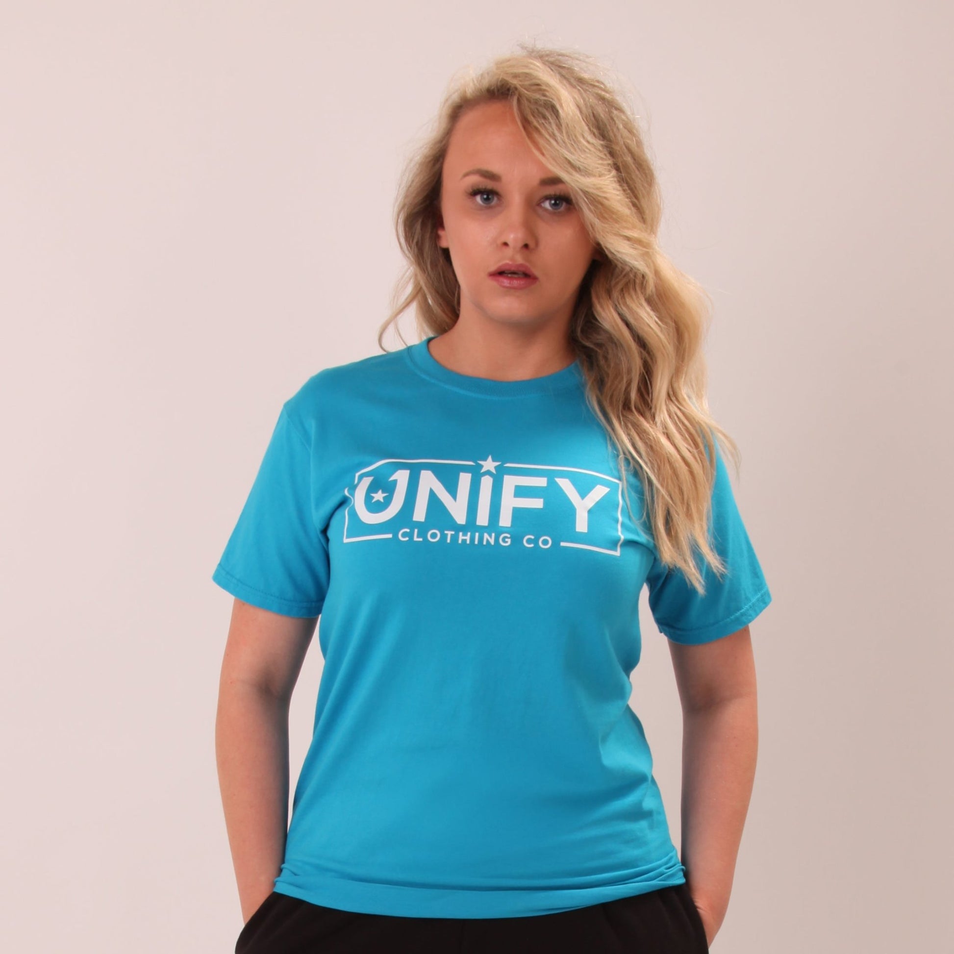"UNIFY women's sapphire blue t-shirt, perfect for a stylish casual look."
