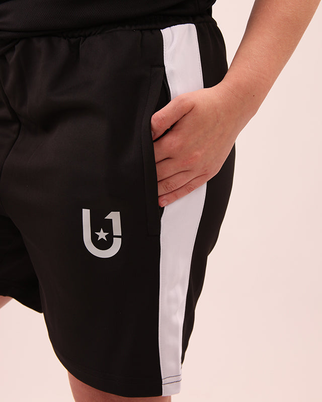 Front view of UNIFY women's black and white striped shorts