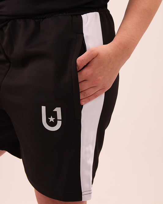 Front view of UNIFY women's black and white striped shorts