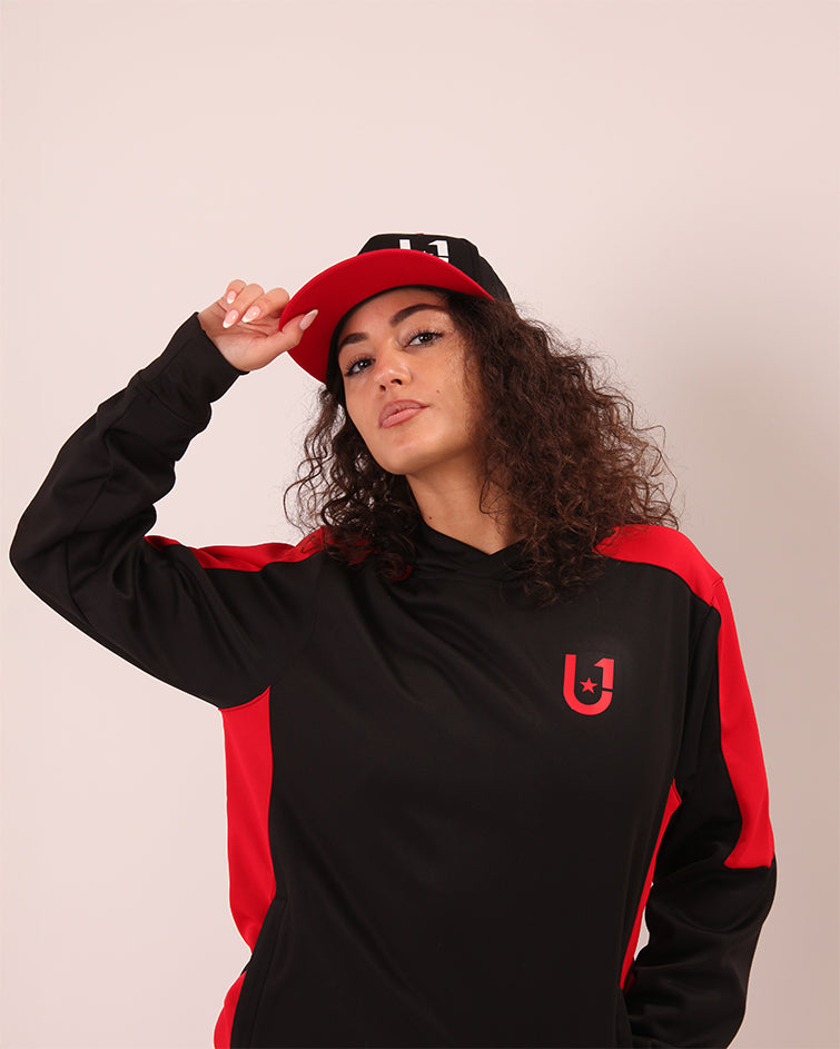 UNIFY women's performance baseball cap, emphasizing its breathable polyester fabric