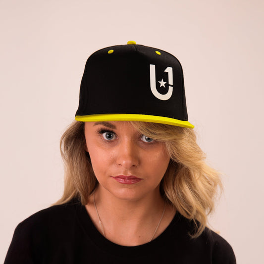 a female model wearing unify yellow baseball hat